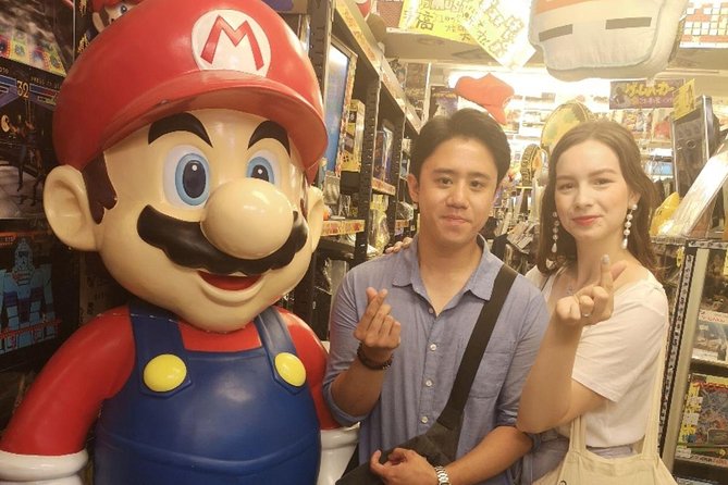 Akihabara Anime & Game Adventure Walking Tour (Group or Private) - Taito Station Akihabara: arcade energy near the Space Invaders sign