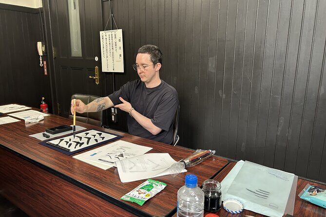 Japanese Calligraphy Class in Yokohama with Tea and Sweets - Copying onto your uchiwa fan like a real craft project