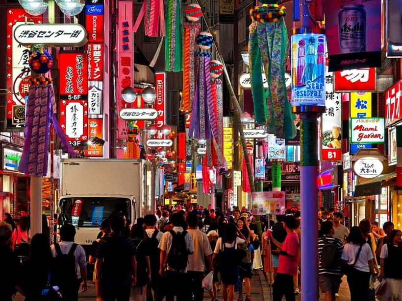 Tokyo: Evening Tour - Temples, Neon Streets & Culture - Shibuya Crossing under billboards: the city’s volume turned up