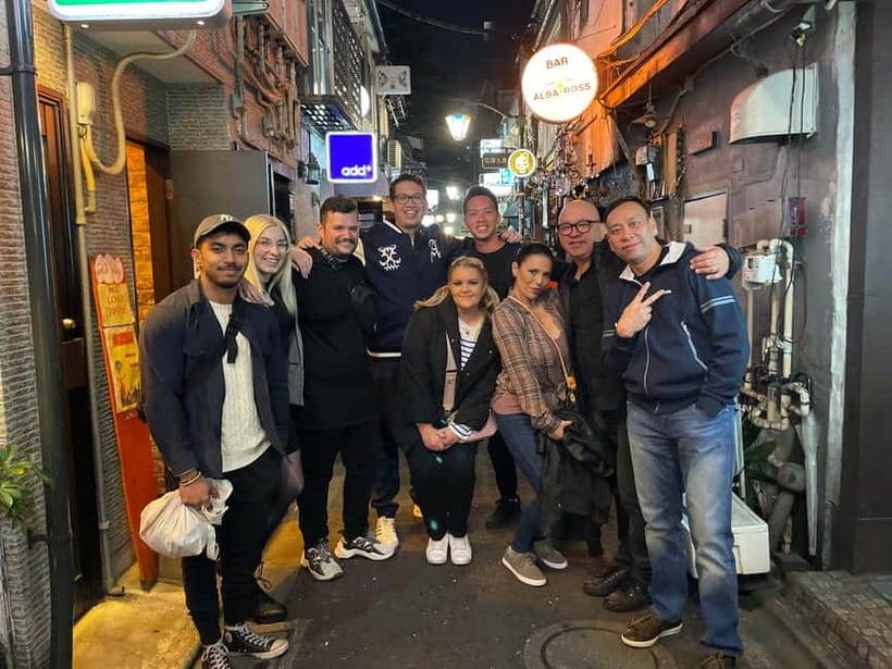 Tokyo: Shinjuku Bar and Izakaya Hopping Tour - Walking at night in Shinjuku: scenery, pace, and group vibes