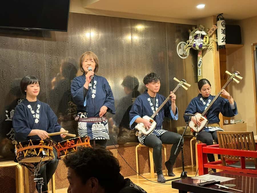 Tokyo: Traditional Asakusa Music Show with Dinner - The izakaya arrival: where the dinner show really starts